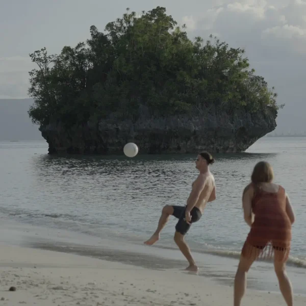 guests playing volleyball at the sunset beach